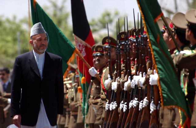 President Hamid Karzai entering the Kabul Military Training Center for the graduation of the 1st battalion, Afghanistan National Army.
